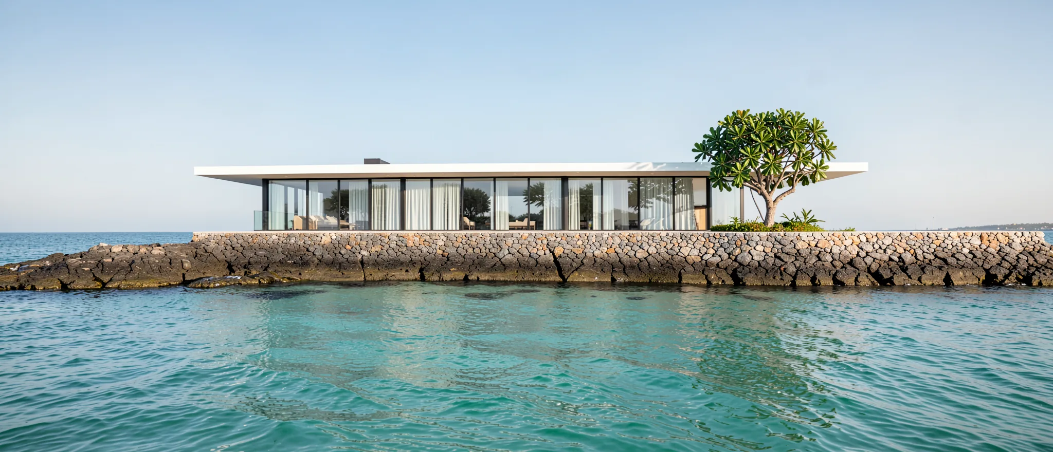 A long glass villa on a seawall over the calm Gulf (illustrative, generated)